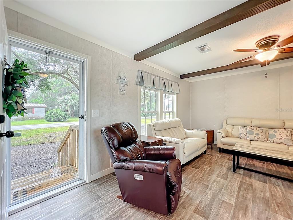 2815 Southwest 89th Place Ocala, FL 34476 - Photo 7 of 36 a living room with furniture and a large window