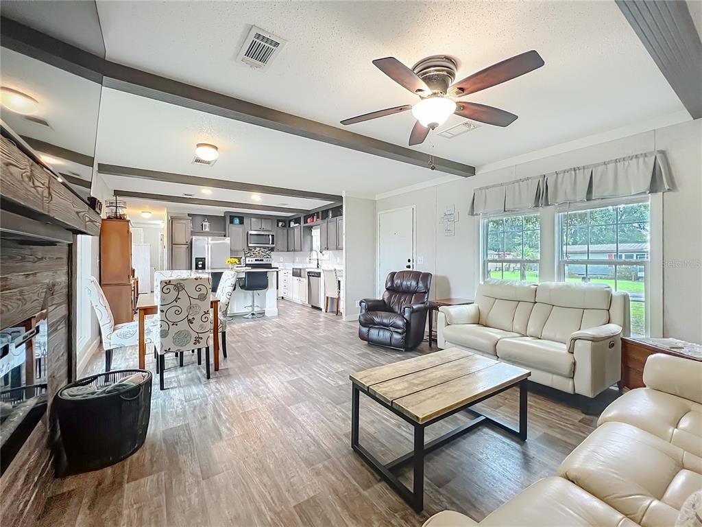 2815 Southwest 89th Place Ocala, FL 34476 - Photo 9 of 36 a living room with furniture and a large window