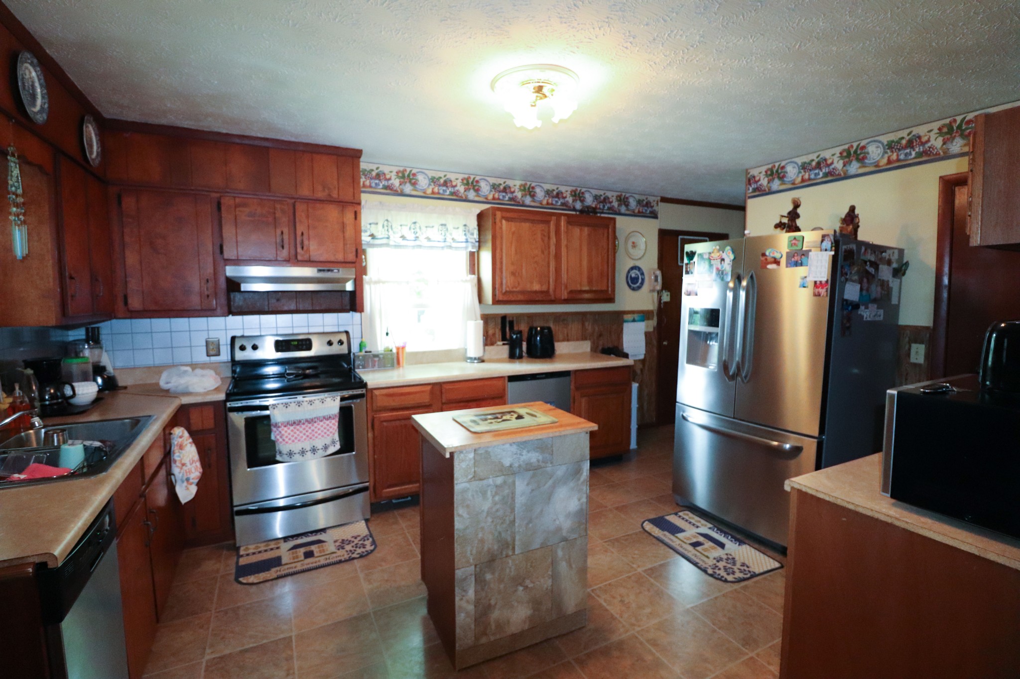 96 Cope Road Morrison, TN 37357 - Photo 5 of 19 a kitchen with stainless steel appliances granite countertop a refrigerator stove and oven