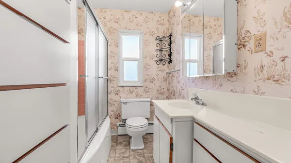 a bathroom with a sink a toilet and a bathtub