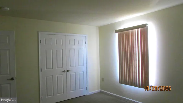 a view of a livingroom and an empty room