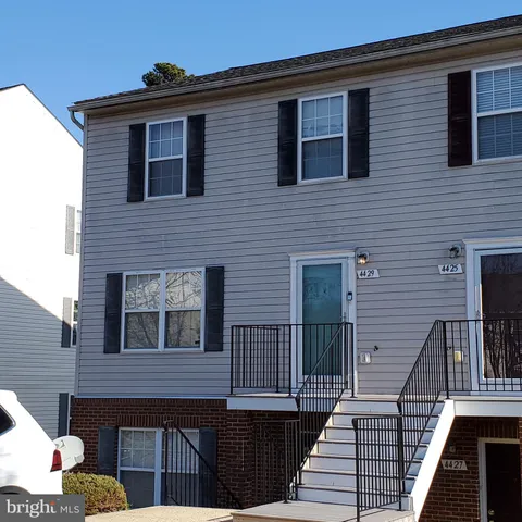 a balcony view with a seating space