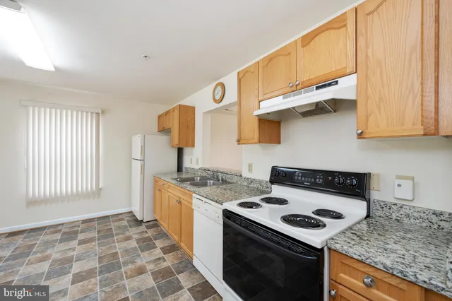 a kitchen with a stove and a sink