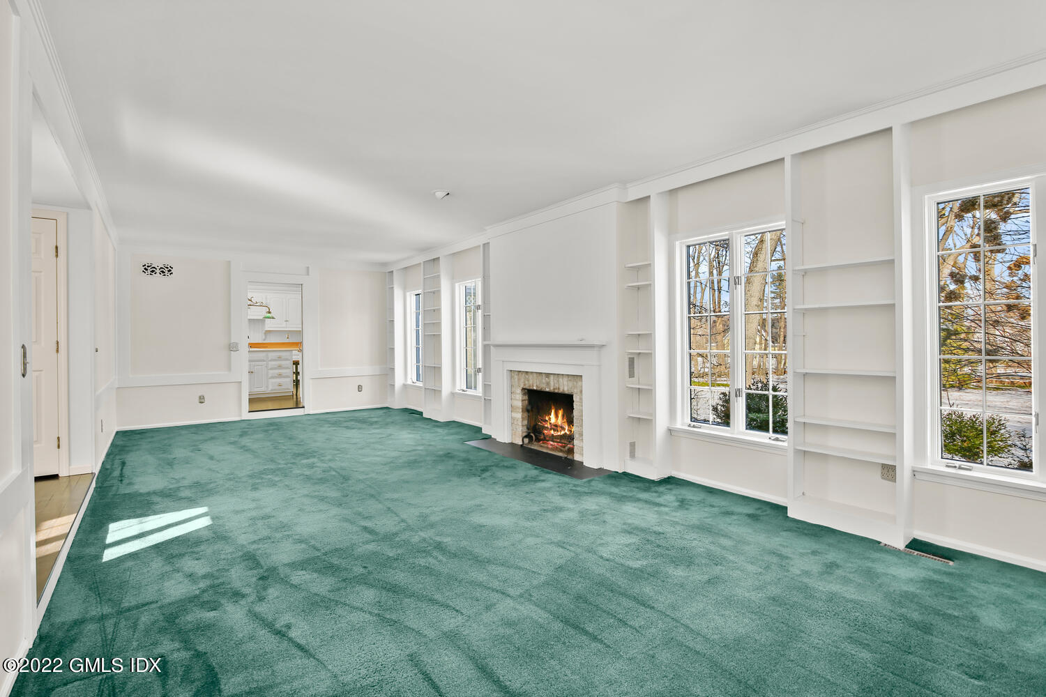 32 Peaceable Street Ridgefield, CT 06877 - Photo 18 of 38 a view of a livingroom with an empty space and a fireplace