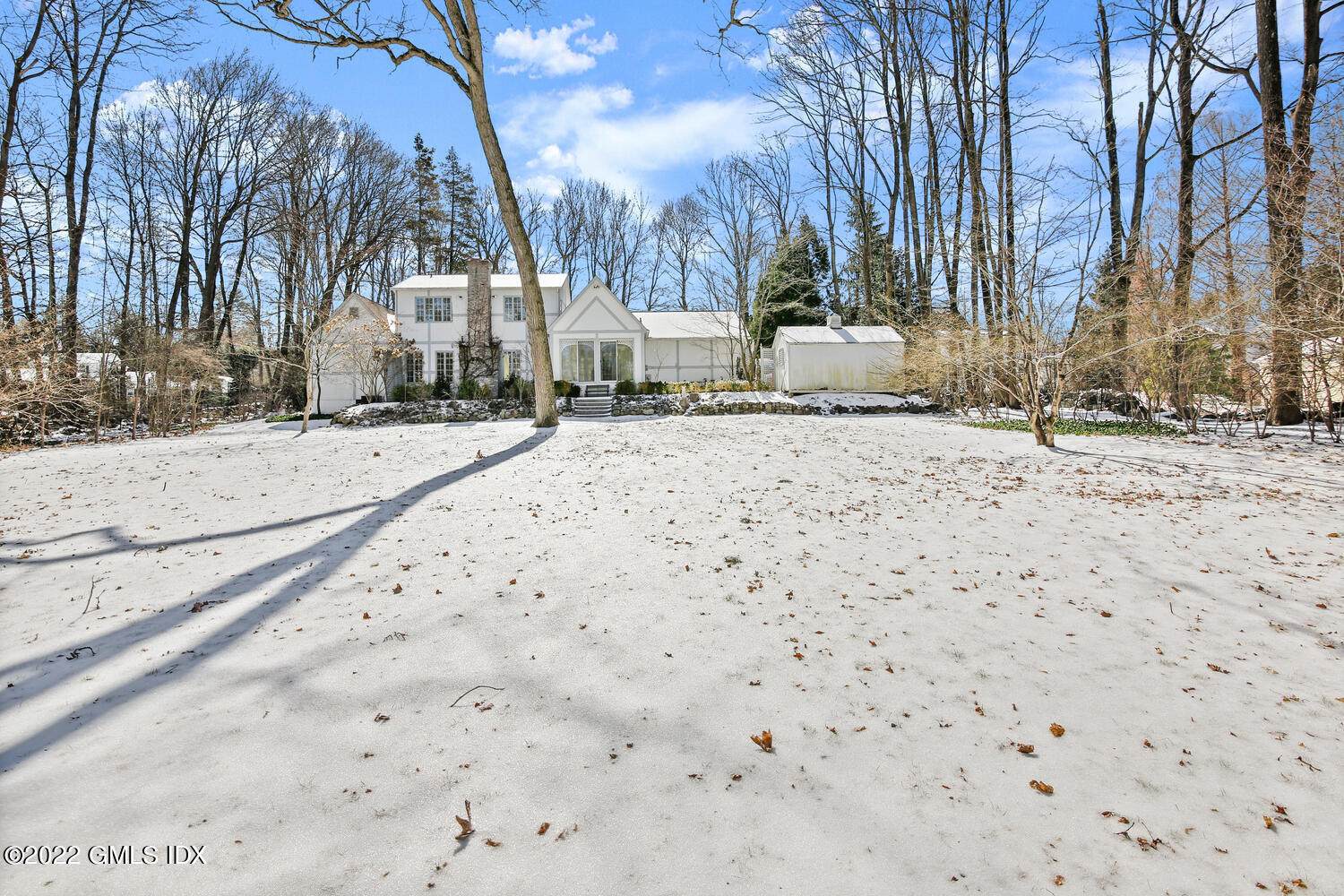 32 Peaceable Street Ridgefield, CT 06877 - Photo 32 of 38 a street view with snow on the road