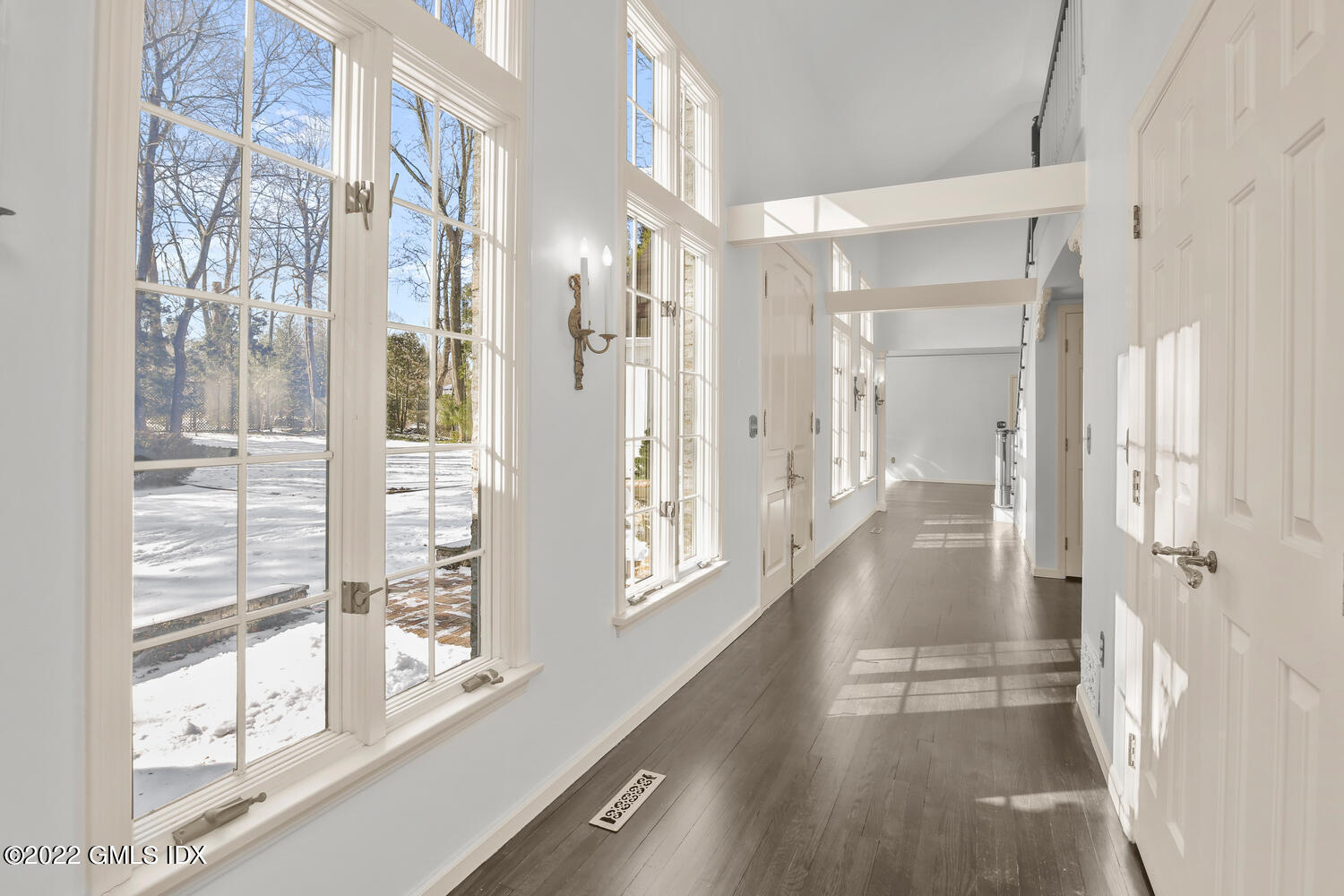 32 Peaceable Street Ridgefield, CT 06877 - Photo 5 of 38 a view of a hallway with windows and entryway
