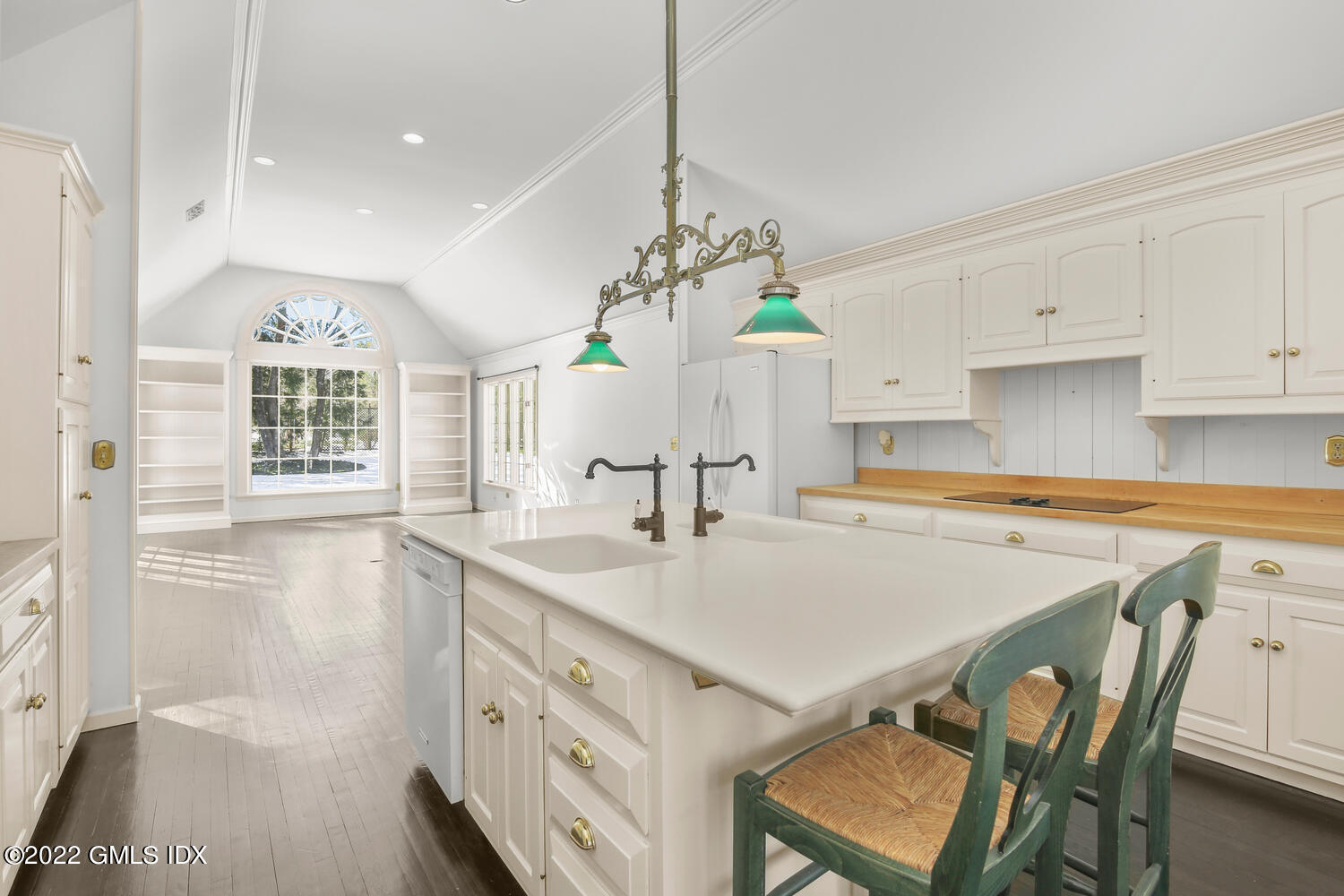 32 Peaceable Street Ridgefield, CT 06877 - Photo 9 of 38 a kitchen with a table chairs sink and cabinets