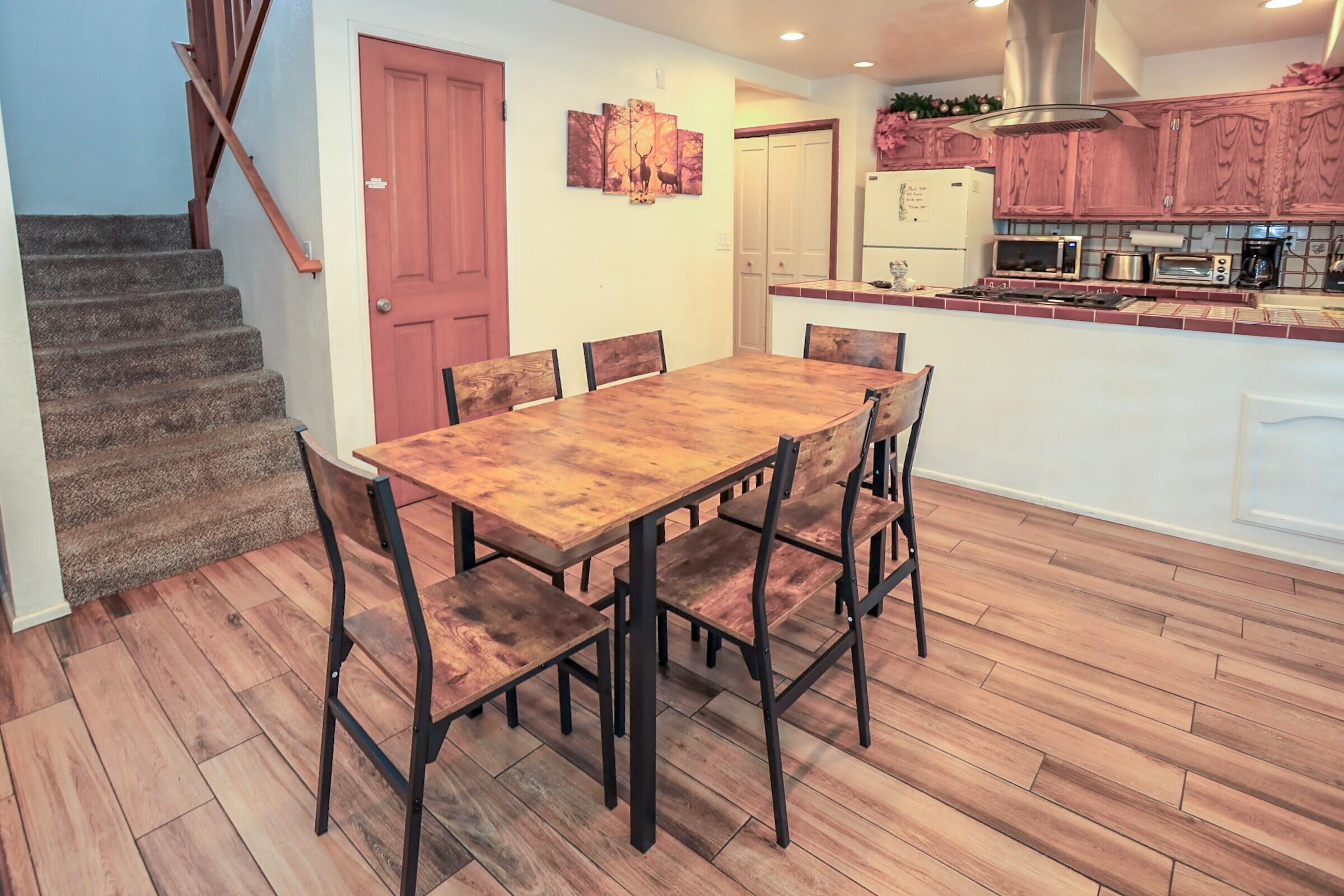 42638 Moonridge Road Big Bear Lake, CA 92315 - Photo 11 of 39 a dining room with furniture and wooden floor