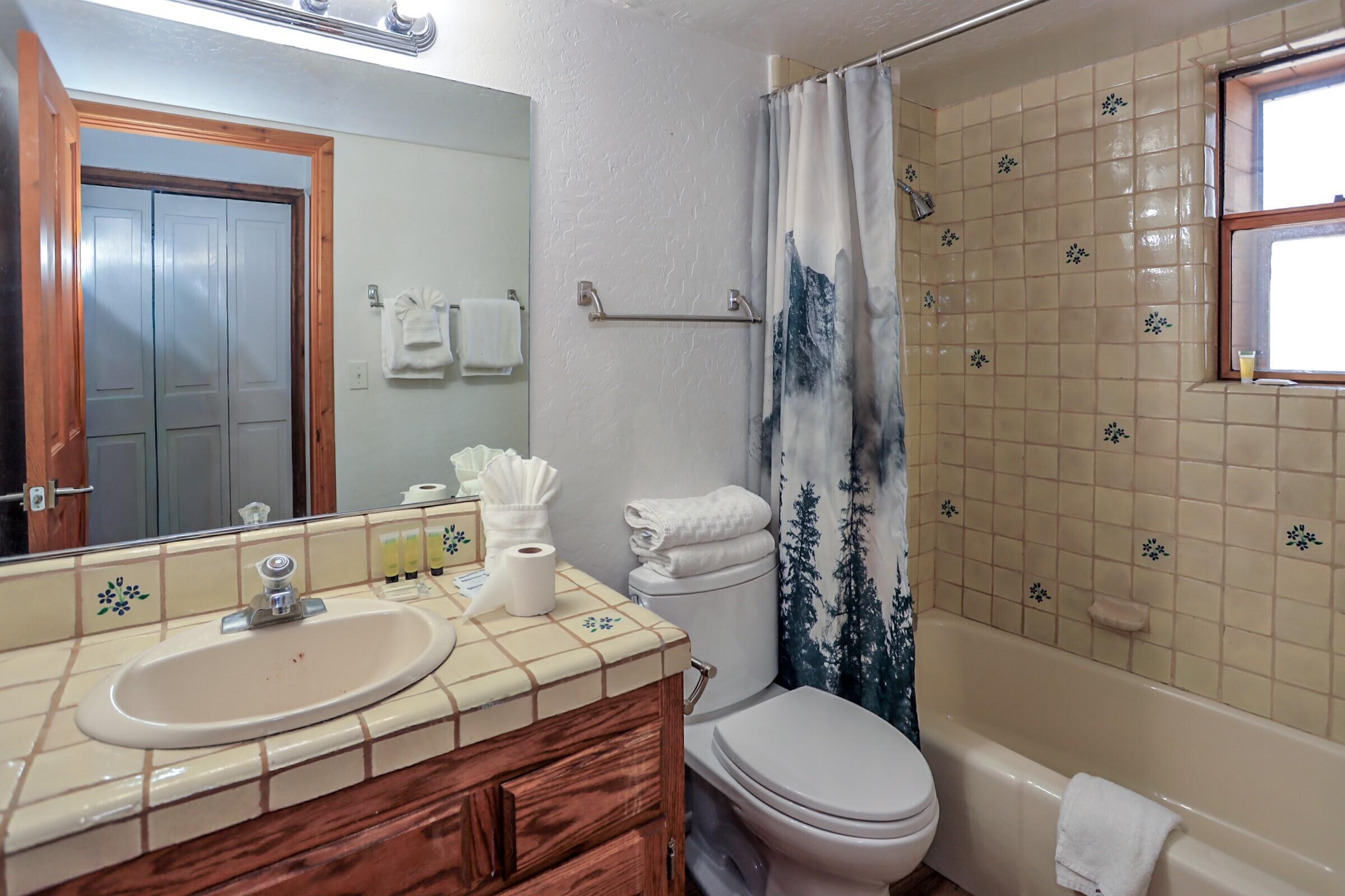 42638 Moonridge Road Big Bear Lake, CA 92315 - Photo 17 of 39 a bathroom with a sink toilet and shower