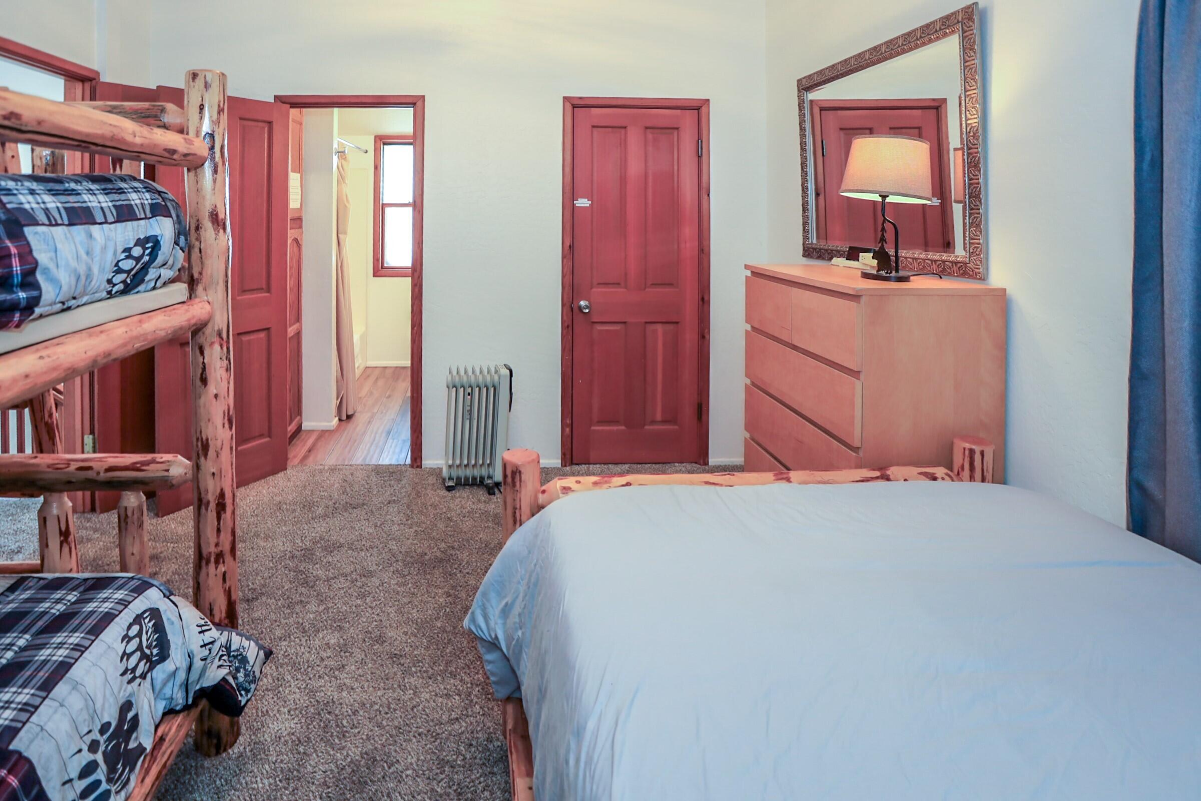 42638 Moonridge Road Big Bear Lake, CA 92315 - Photo 21 of 39 a bedroom with a bed and a cabinets
