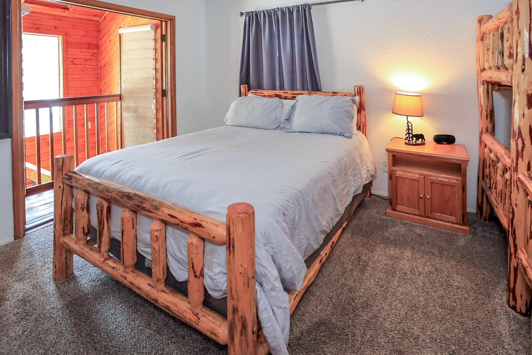 42638 Moonridge Road Big Bear Lake, CA 92315 - Photo 24 of 39 a large bed sitting in a bedroom next to a window