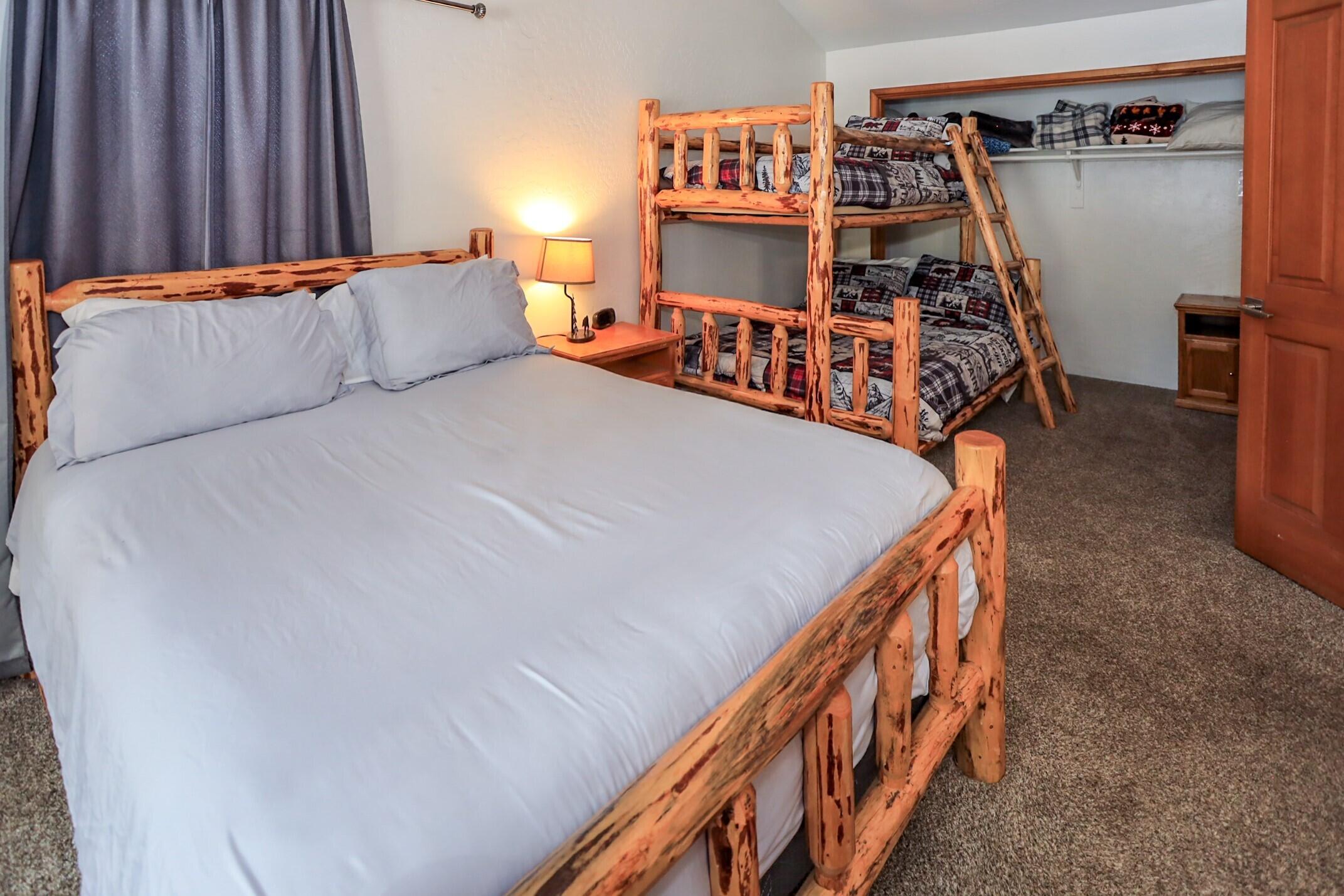 42638 Moonridge Road Big Bear Lake, CA 92315 - Photo 26 of 39 a bed sitting in a bedroom next to a window