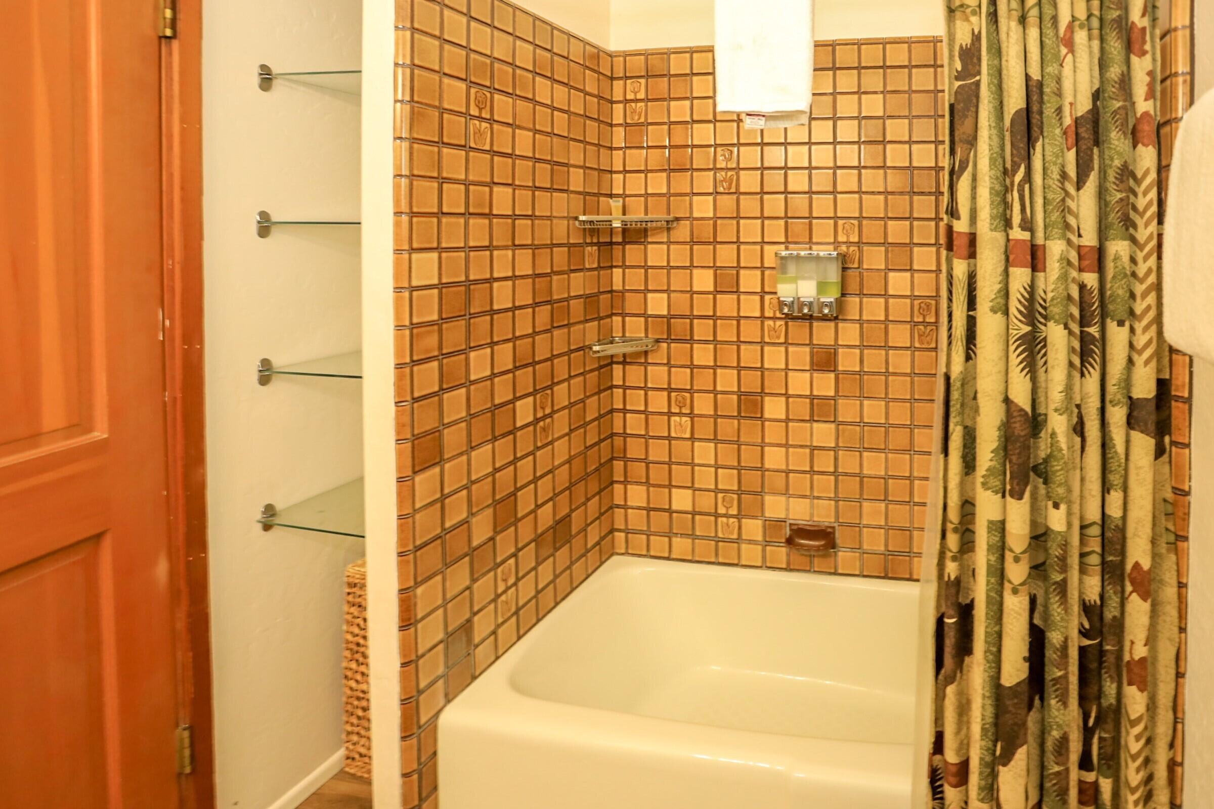 42638 Moonridge Road Big Bear Lake, CA 92315 - Photo 30 of 39 a bathroom with a bathtub and shower