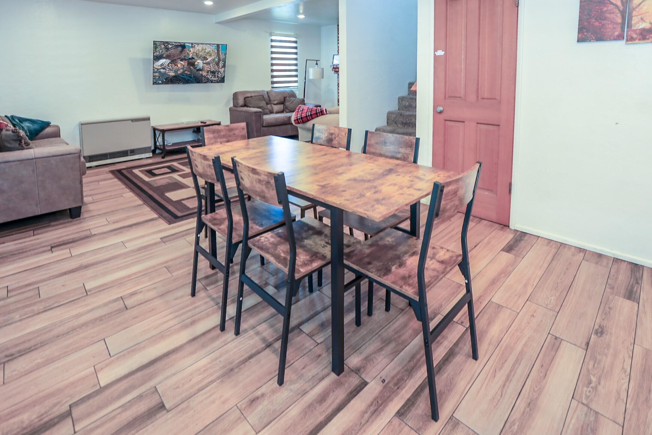 42638 Moonridge Road Big Bear Lake, CA 92315 - Photo 9 of 39 a view of a dining room with furniture and wooden floor