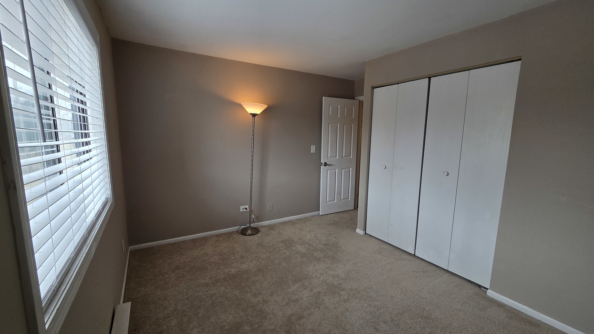 627 South Virginia Road, Unit 212 Crystal Lake, IL 60014 - Photo 13 of 15 a view of an empty room with a window