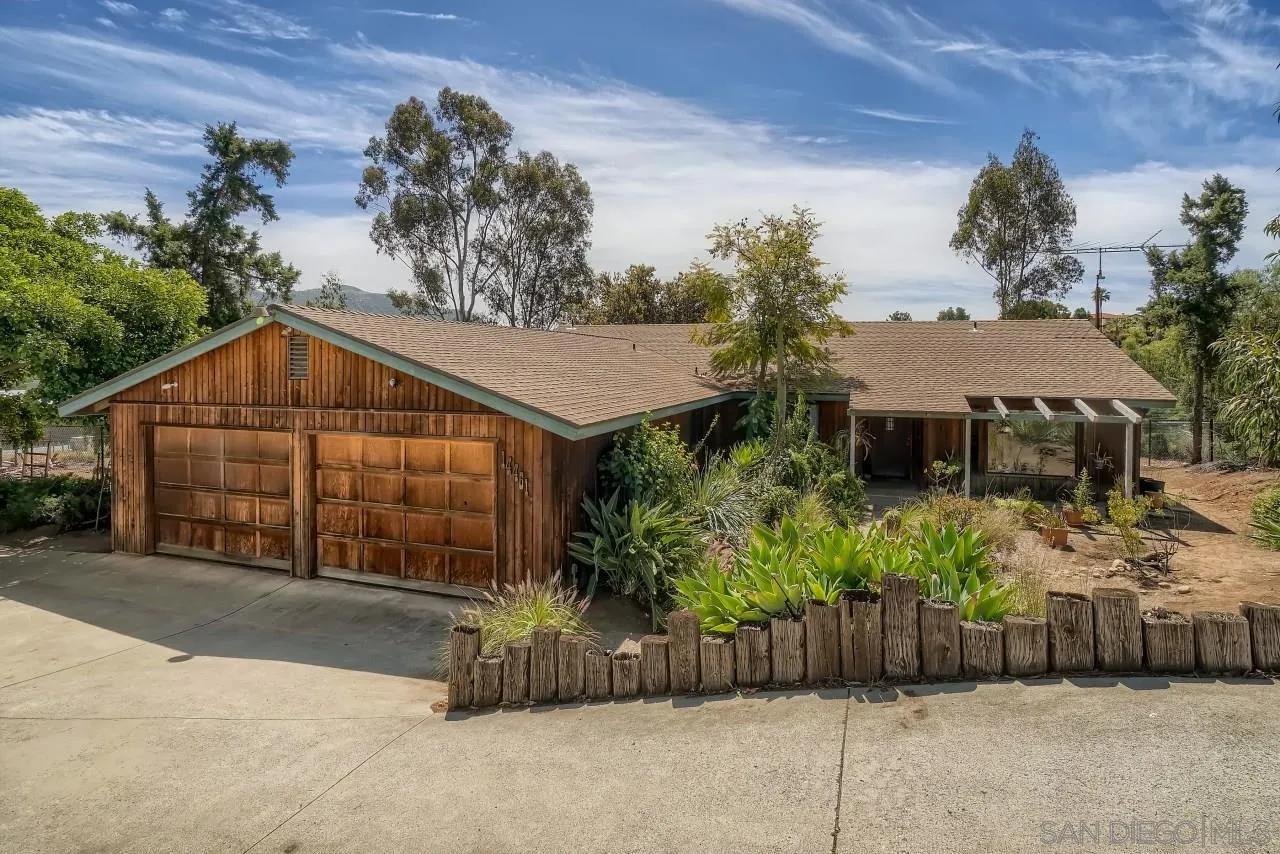 14461 Lyons Valley Road Jamul, CA 91935 - Photo 1 of 27 a view of a house with a yard and potted plants