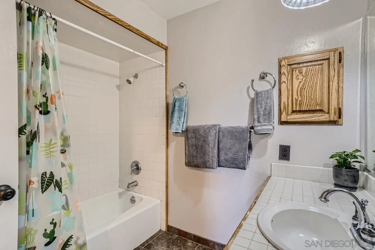 14461 Lyons Valley Road Jamul, CA 91935 - Photo 19 of 27 a bathroom with a sink a toilet and shower