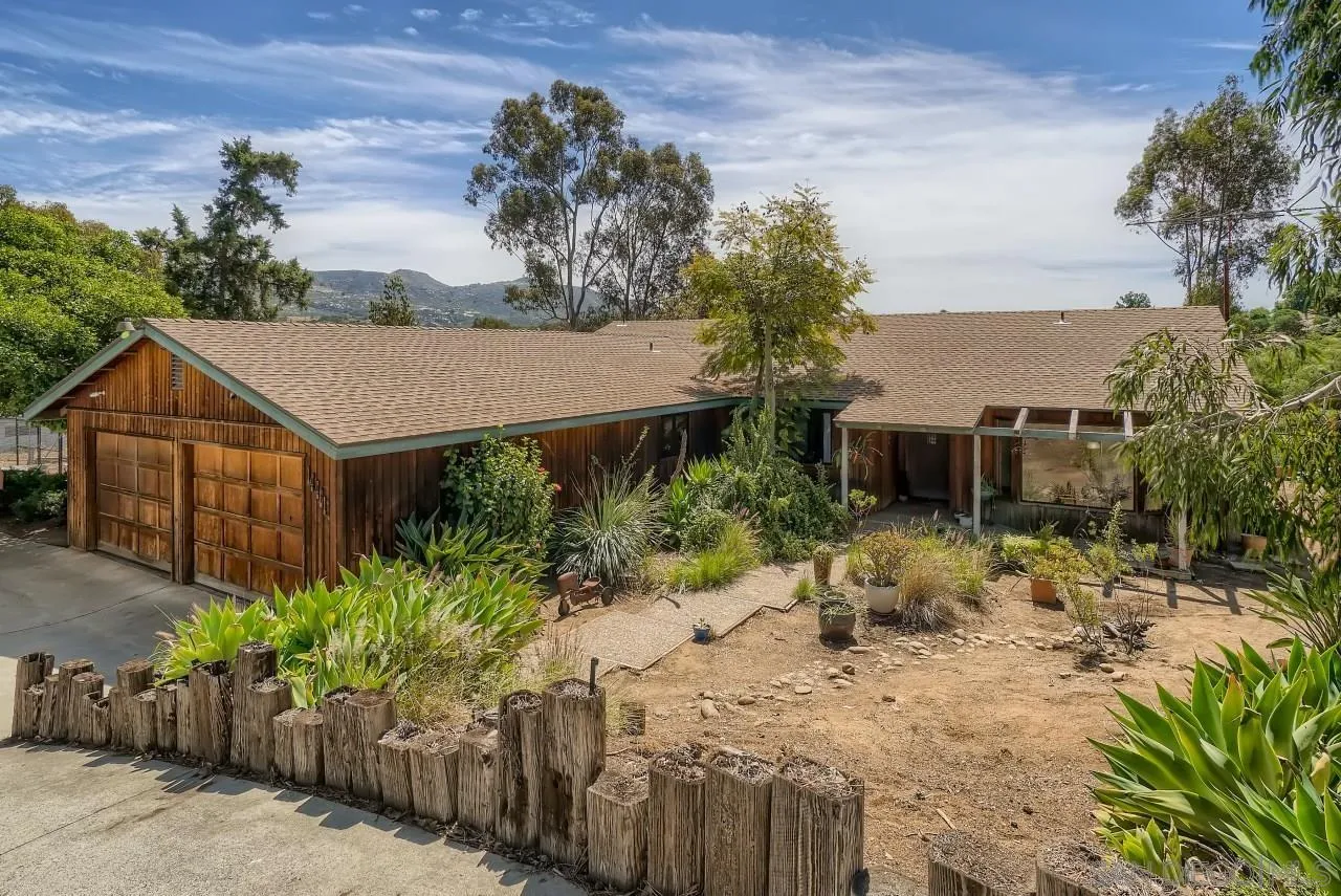14461 Lyons Valley Road Jamul, CA 91935 - Photo 2 of 27 a view of a house with a yard and large tree