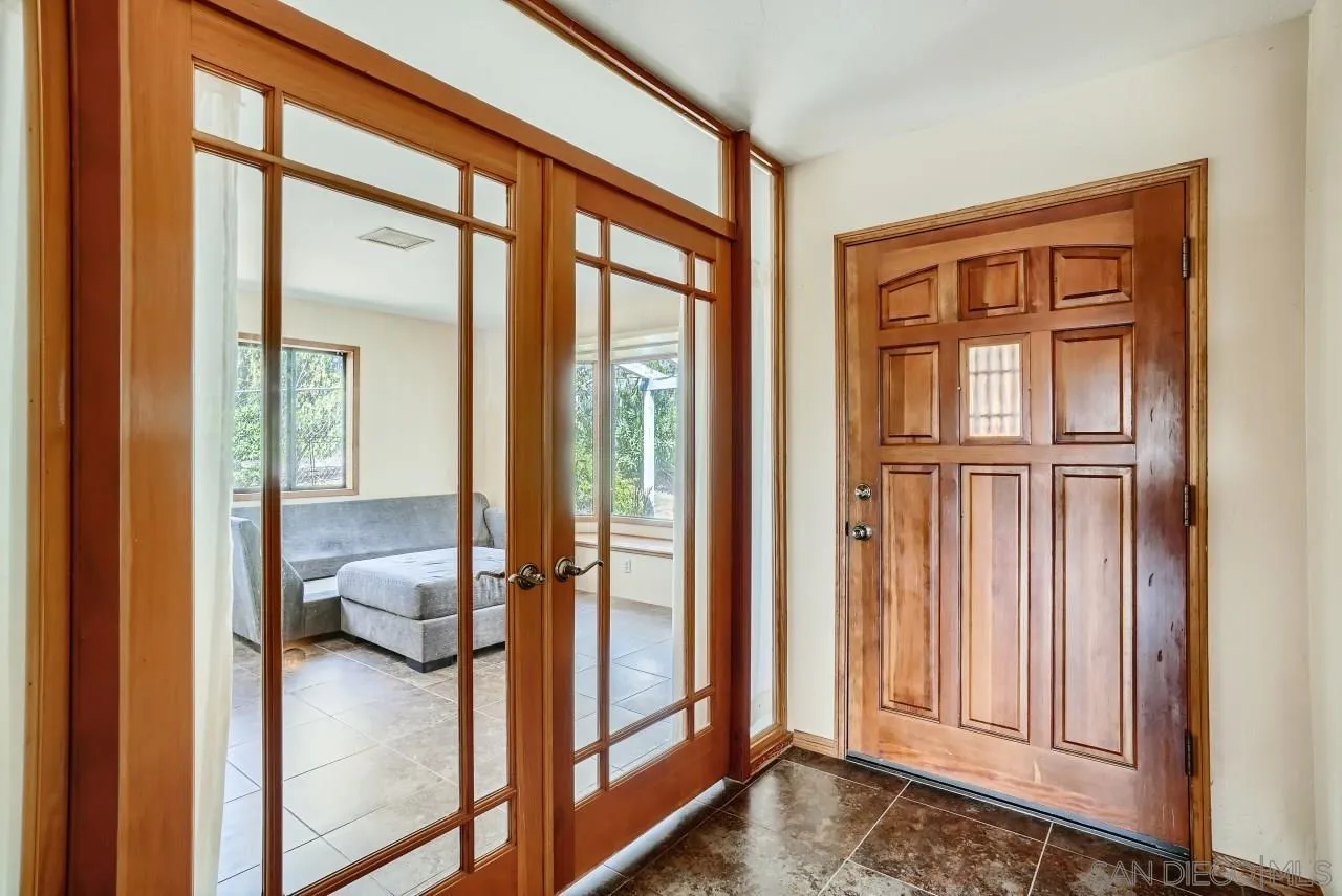 14461 Lyons Valley Road Jamul, CA 91935 - Photo 4 of 27 a view of a hallway and a livingroom with wooden floor