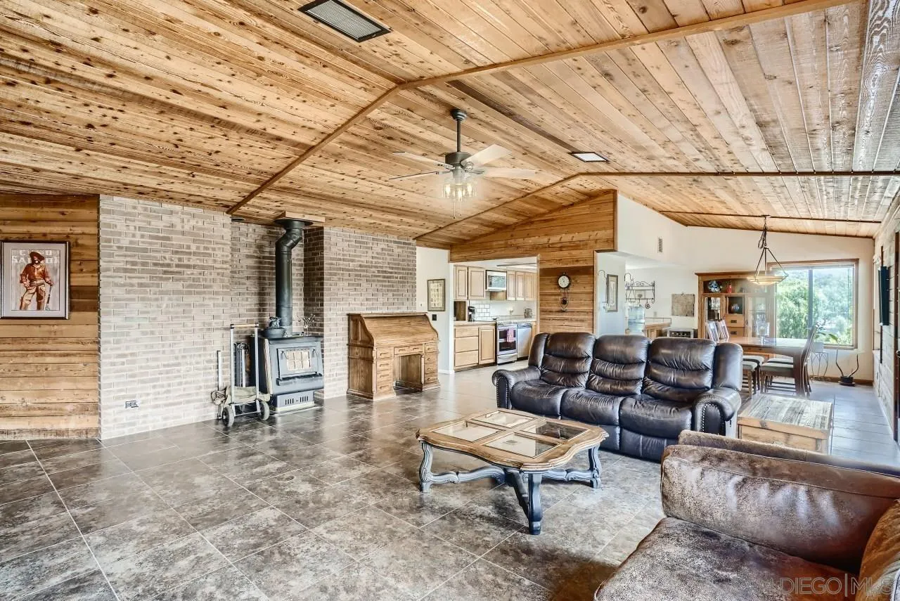 14461 Lyons Valley Road Jamul, CA 91935 - Photo 6 of 27 a living room with furniture and a fireplace