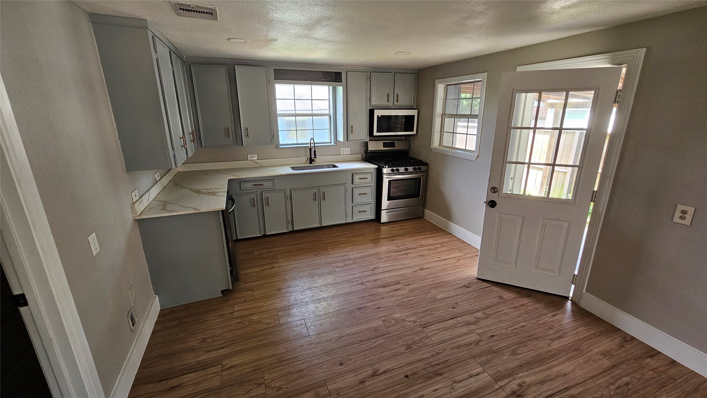 2415 Perry Street Baytown, TX 77521 - Photo 5 of 23 Kitchen includes gas range, microwave and dishwasher