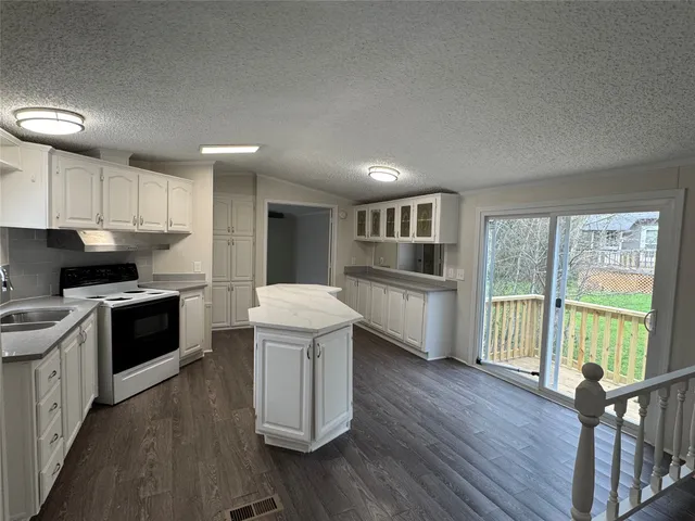 a kitchen with a sink and cabinets