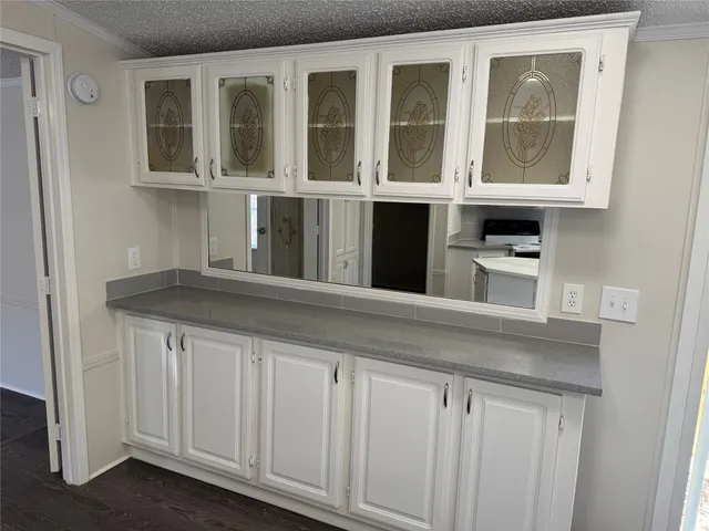 a bathroom with a tub shower and sink