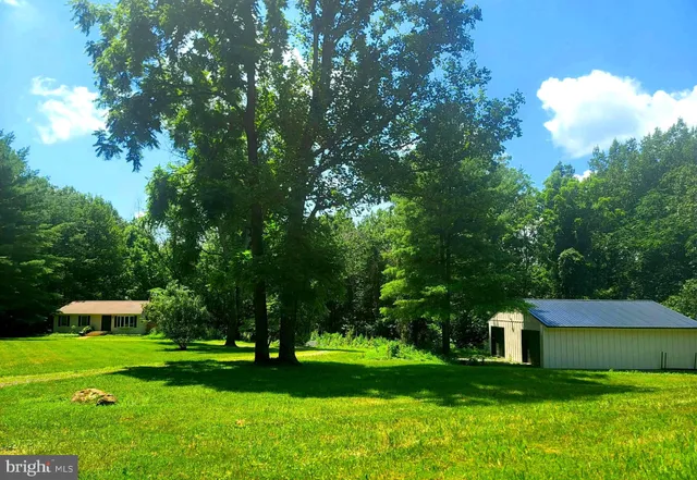 a view of a table and chairs in the garden