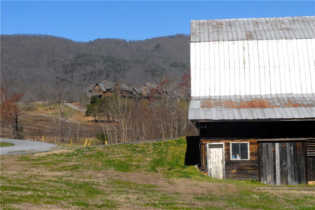 0 Deep Gap Farm Road East, Unit 2027 Mill Spring, NC 28756 - Photo 6 of 7 a backyard of a house with lots of green space