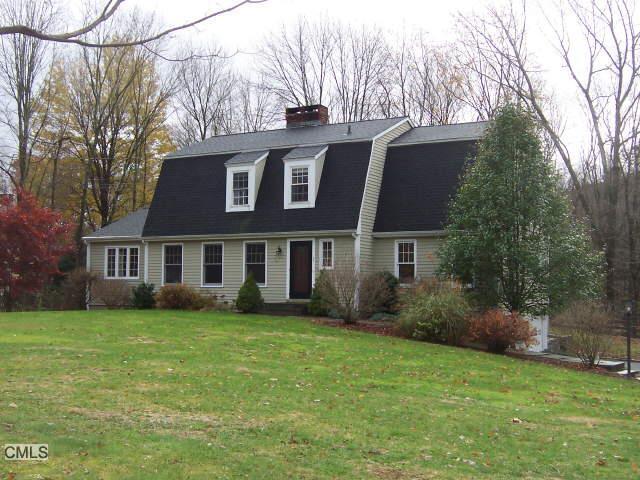 1 Dug Hill Road Newtown, CT 06470 - Photo 1 of 1 a front view of a house with a garden