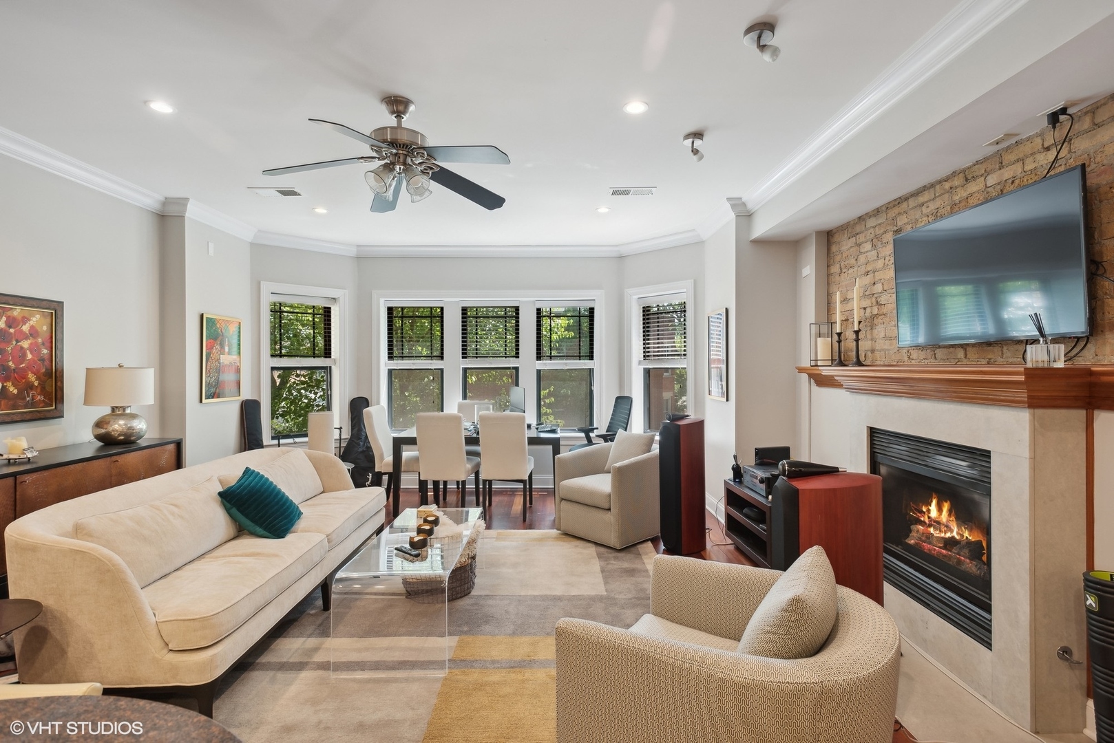 2324 West Argyle Street, Unit 2E Chicago, IL 60625 - Photo 2 of 14 a living room with furniture and a fireplace