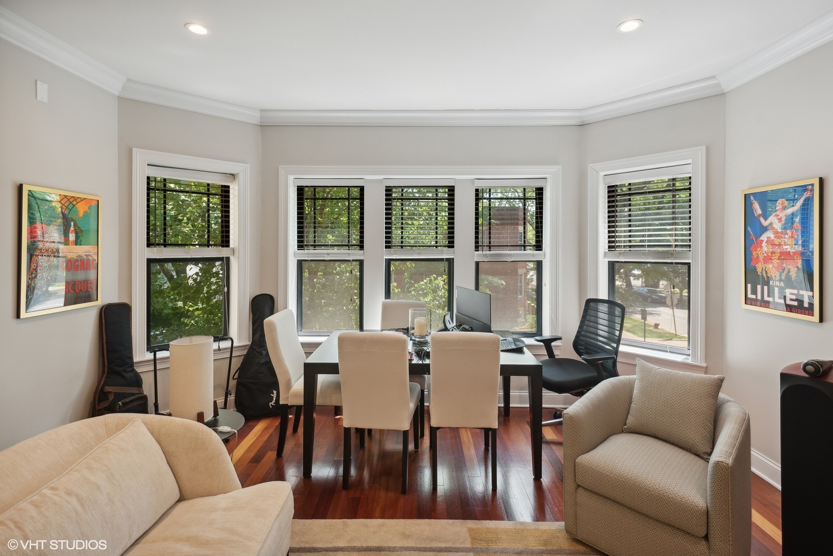 2324 West Argyle Street, Unit 2E Chicago, IL 60625 - Photo 4 of 14 a view of a dining room with furniture a couch and wooden floor