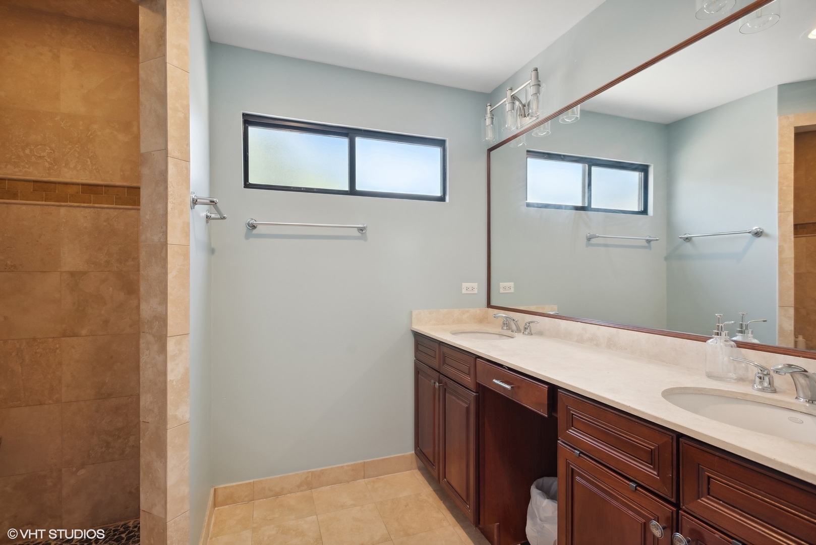 2324 West Argyle Street, Unit 2E Chicago, IL 60625 - Photo 10 of 14 a bathroom with a sink a vanity and a mirror
