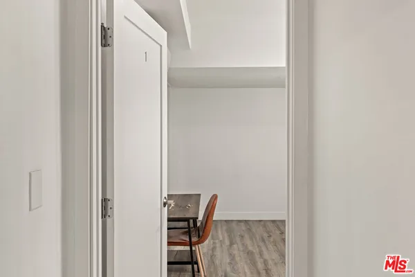 a view of room with table and chair