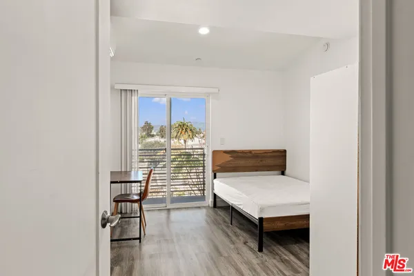 a bedroom with a bed and a table