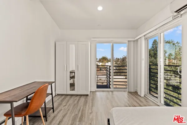 a bedroom with a bed and a table