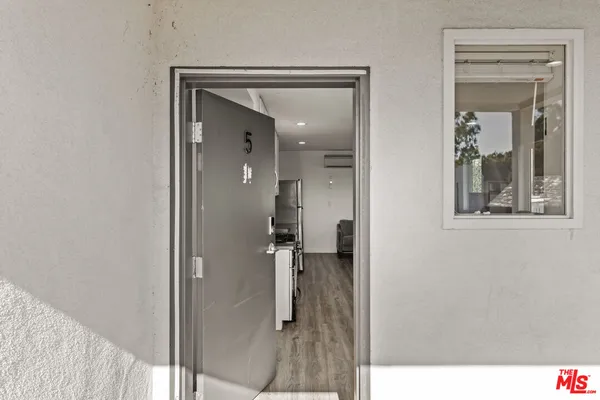 a en suite bathroom with a shower sink and mirror