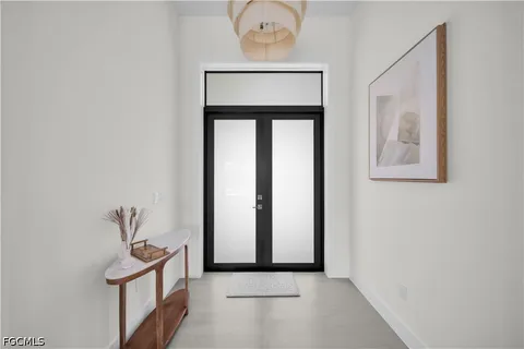 a view of a hallway with front door