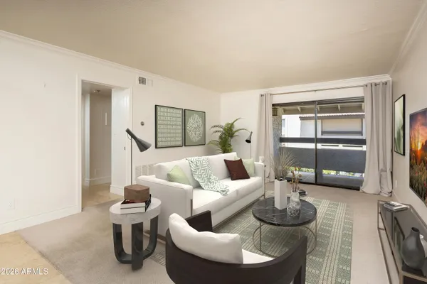 a living room with furniture and a large window