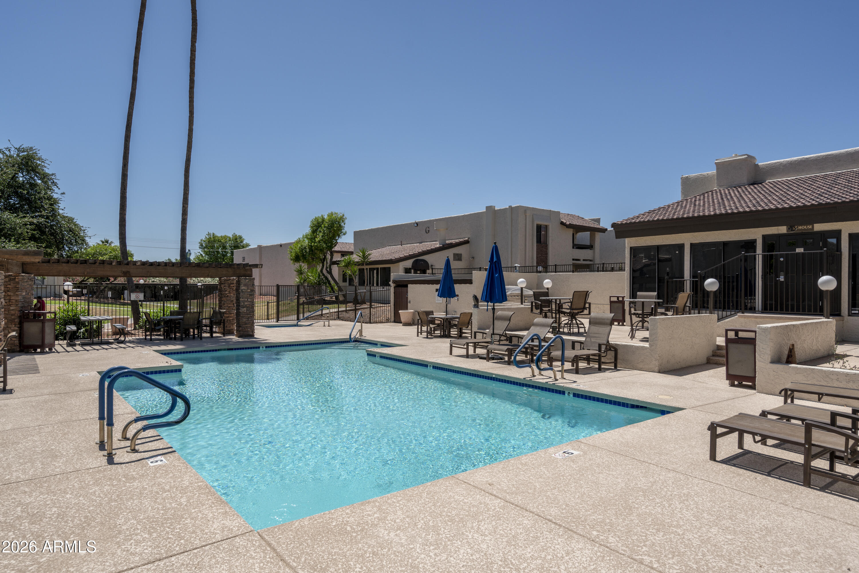 3825 East Camelback Road, Unit 269 Phoenix, AZ 85018 - Photo 20 of 25 a view of a house with swimming pool and sitting area