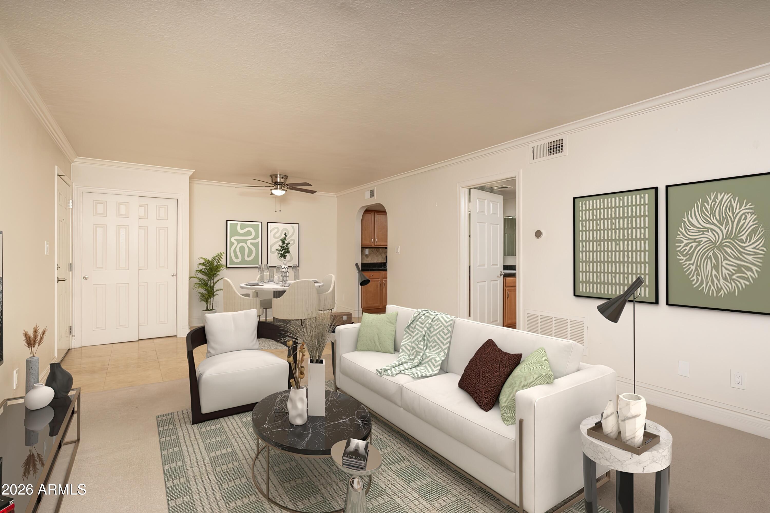 3825 East Camelback Road, Unit 269 Phoenix, AZ 85018 - Photo 3 of 25 a living room with furniture and a wooden floor
