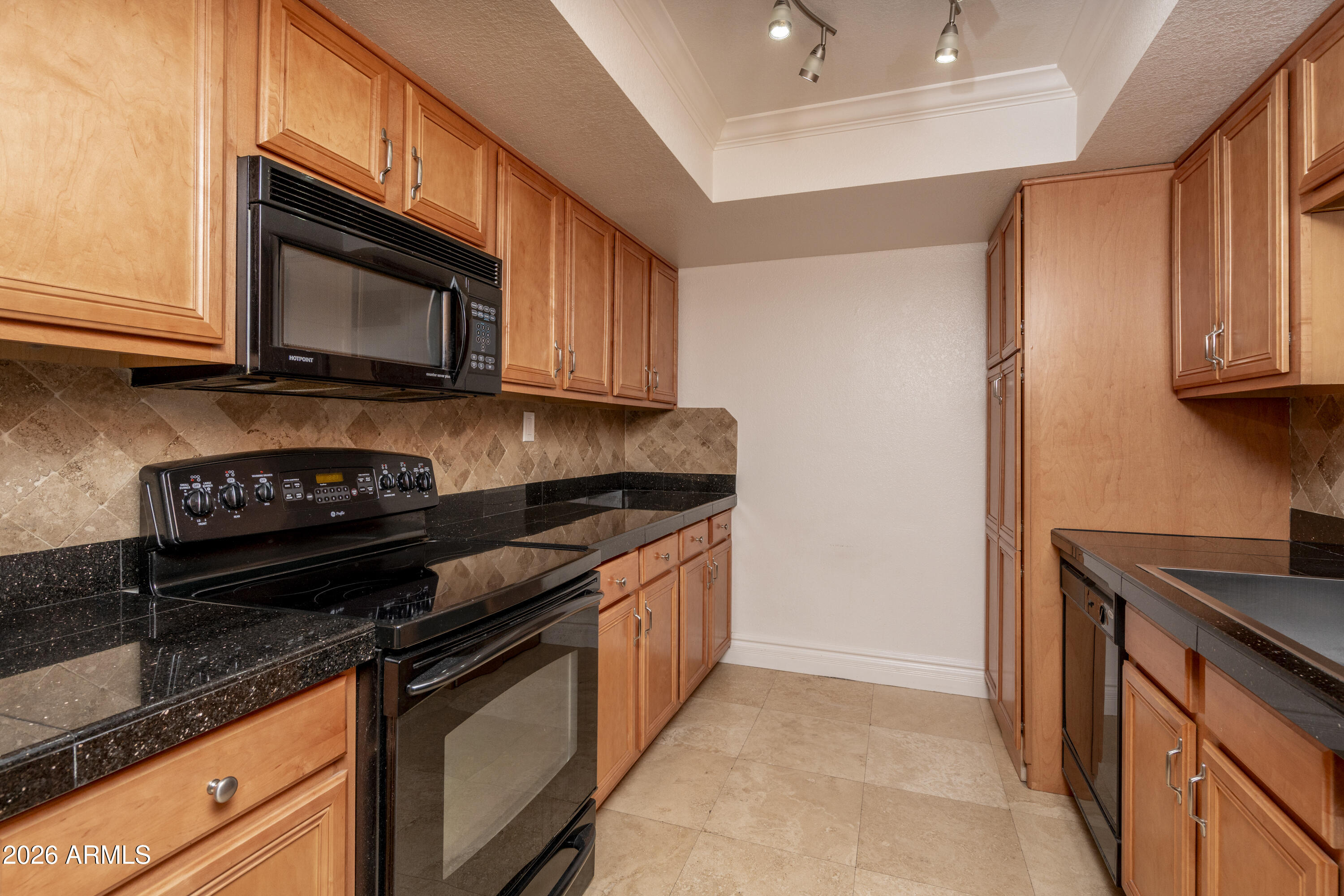 3825 East Camelback Road, Unit 269 Phoenix, AZ 85018 - Photo 5 of 25 a kitchen with granite countertop cabinets and steel stainless steel appliances