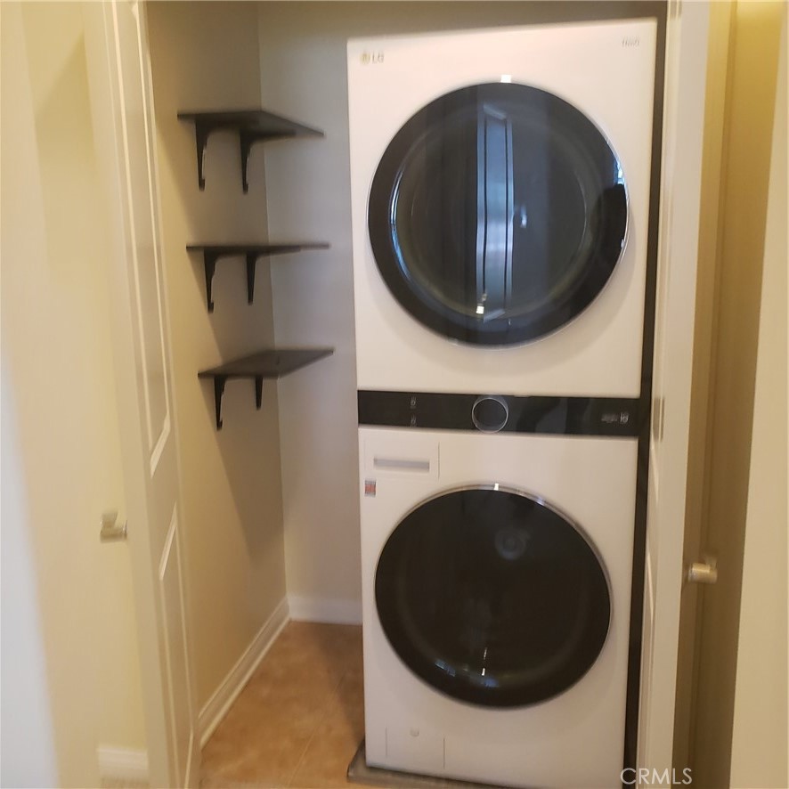 21 Courant Irvine, CA 92618 - Photo 8 of 27 a utility room with dryer and washer