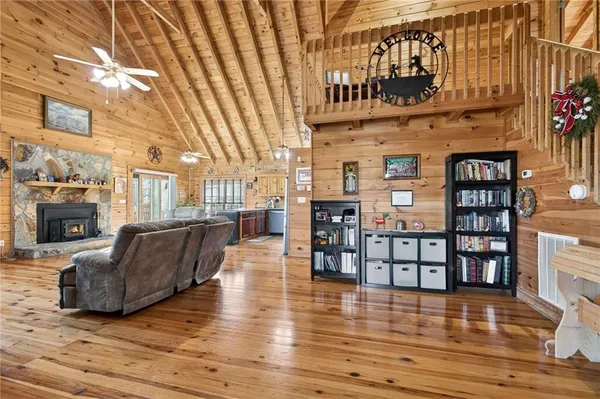 a view of a chairs and walk in closet