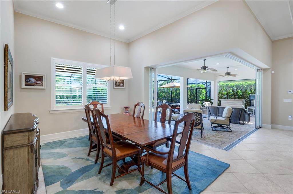 9282 Quarry Drive Naples, FL 34120 - Photo 14 of 50 a view of a dining room with furniture window and outside view