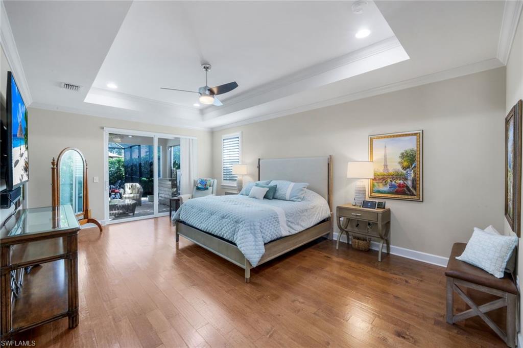 9282 Quarry Drive Naples, FL 34120 - Photo 15 of 50 a bedroom with a bed furniture and a window