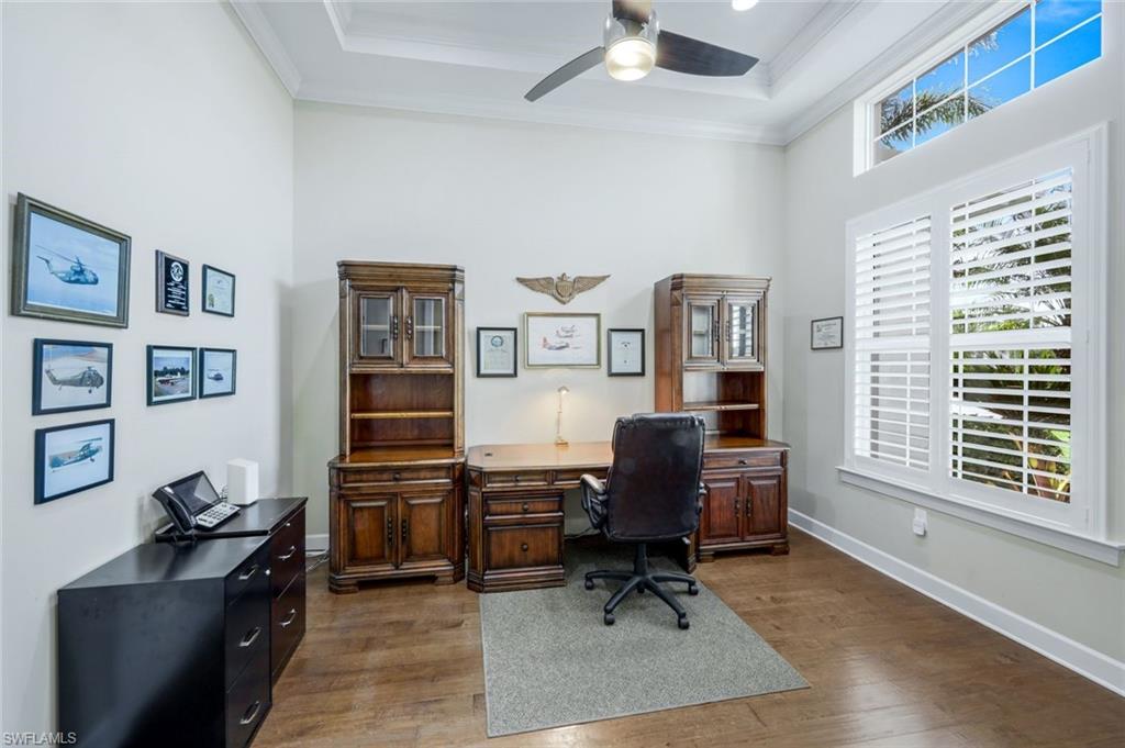 9282 Quarry Drive Naples, FL 34120 - Photo 21 of 50 a view of a workspace with furniture and a window
