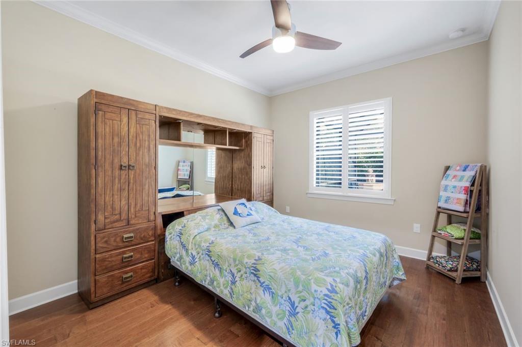 9282 Quarry Drive Naples, FL 34120 - Photo 22 of 50 a bedroom with a bed and a window