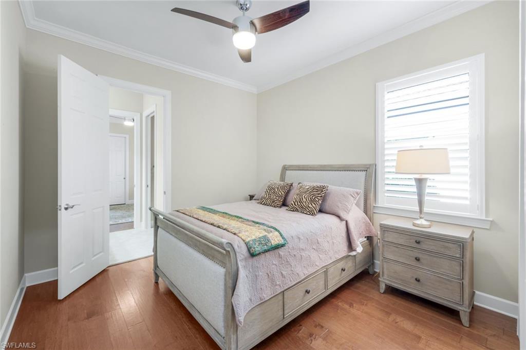 9282 Quarry Drive Naples, FL 34120 - Photo 24 of 50 a bedroom with a bed and a window