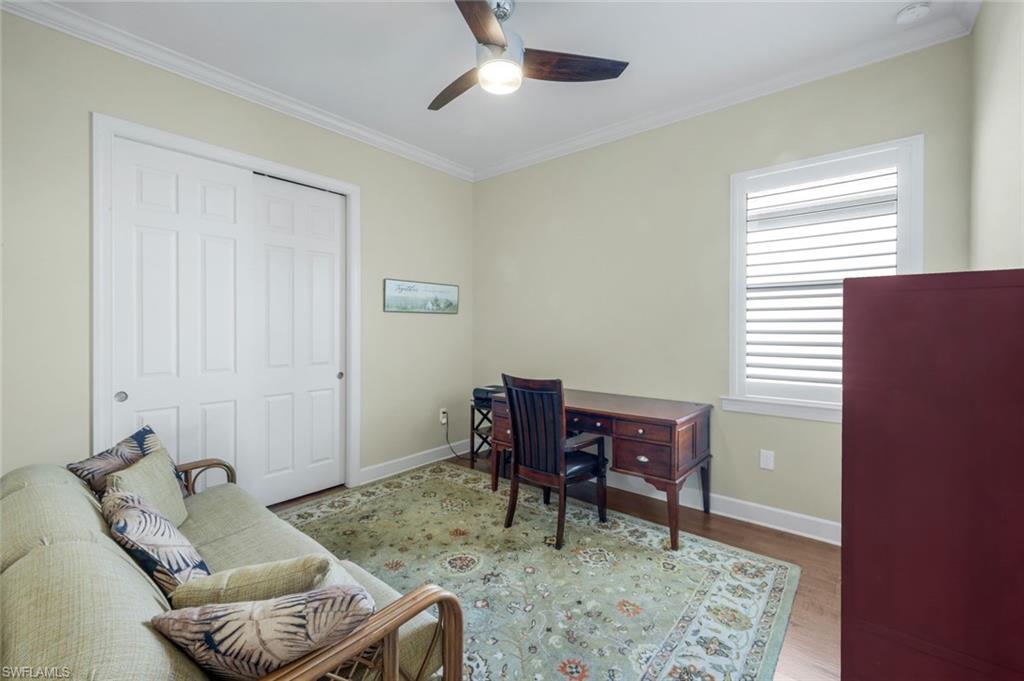 9282 Quarry Drive Naples, FL 34120 - Photo 26 of 50 a living room with furniture and a window